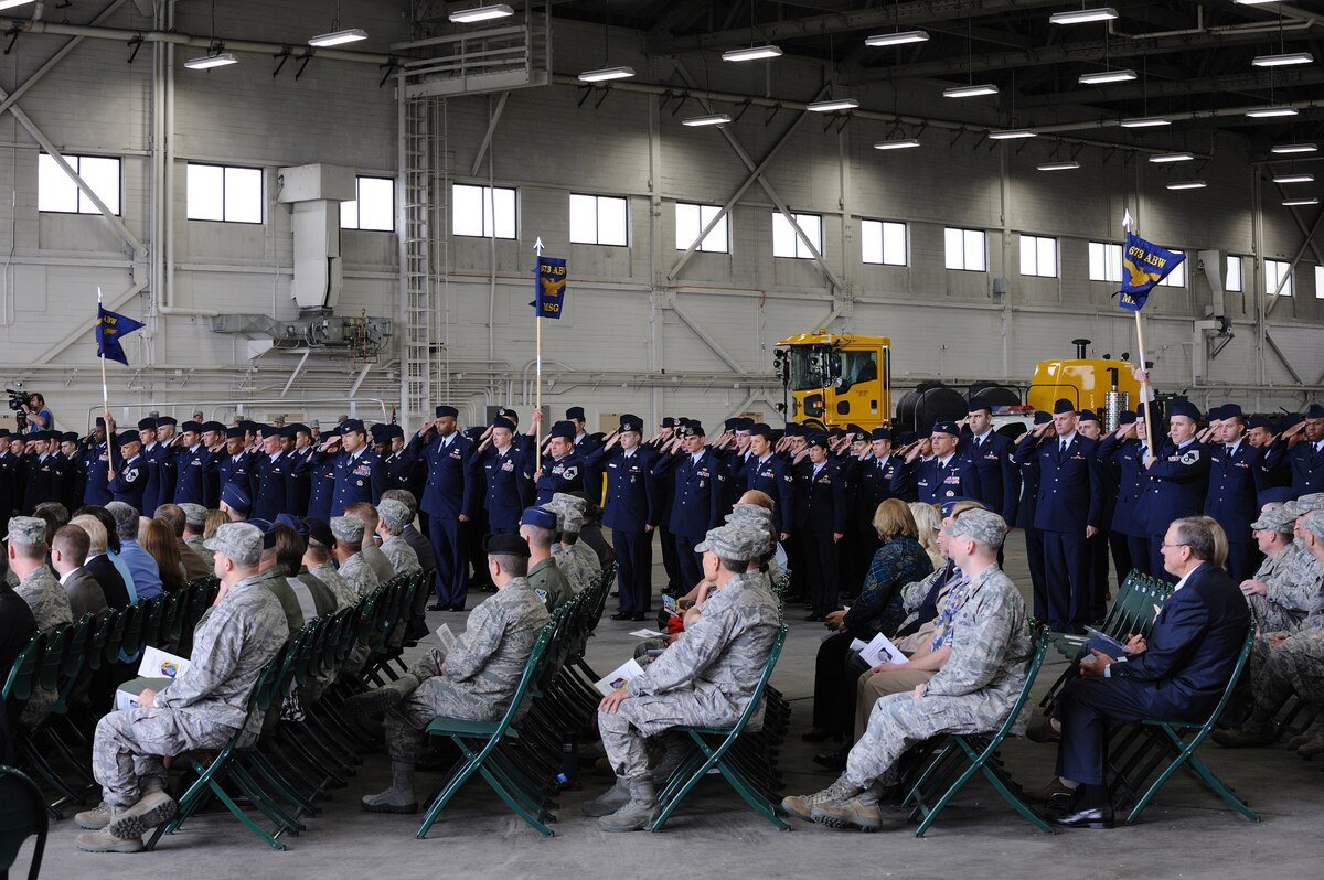 Members of the 673d Air Base Wing (673d ABW) render their first salute to the commander during the unit's activation ceremony July 30.