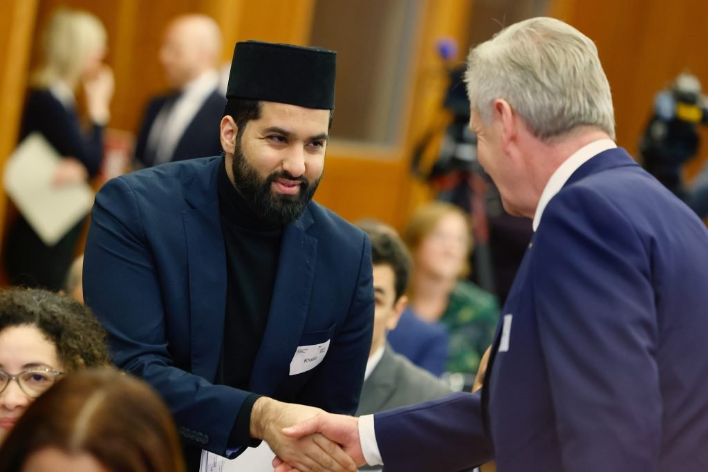 Scharjil Khalid (L) at the German Islam Conference in Berlin, 2023, with former German President Christian Wulff.