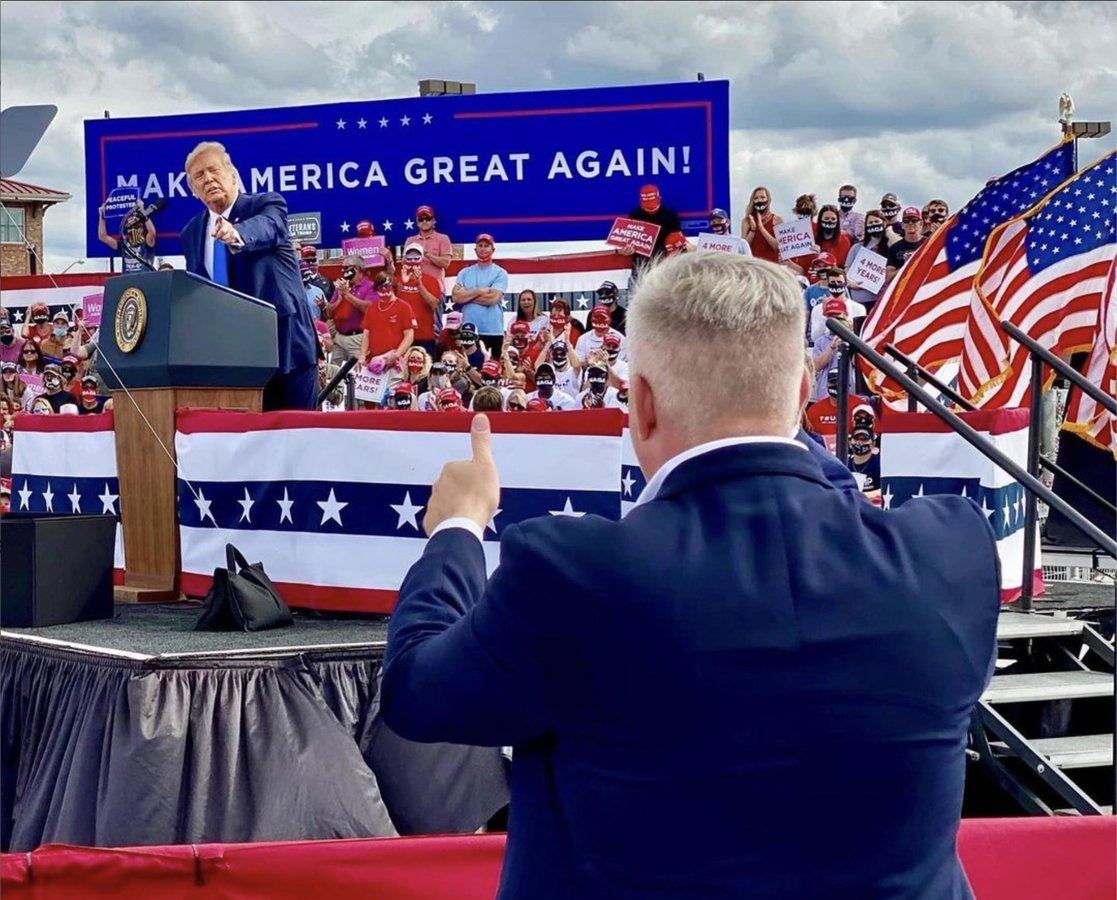 Trump and Whatley give each other a 'thumbs up' at a rally.