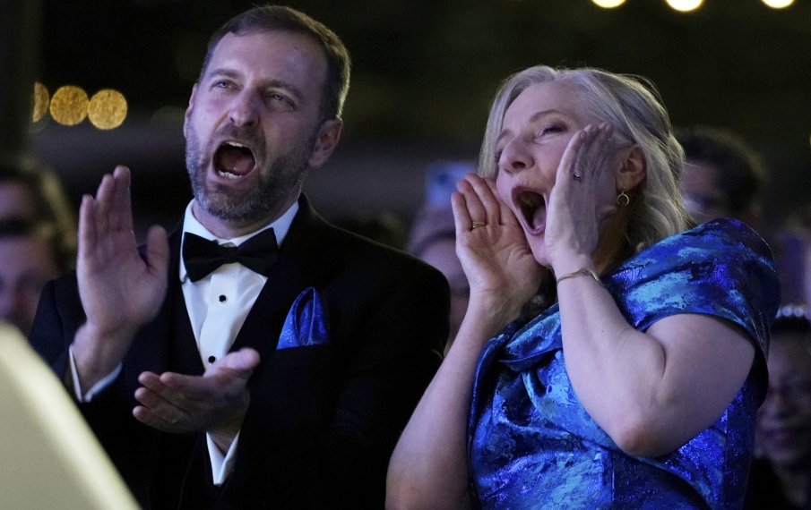 Virginia Gov. Abigail Spanberger, right, and her husband Adam enjoy a performance by Dave Matthews at the Inaugural Ball in Richmond Va., Saturday, Jan. 17, 2026.
