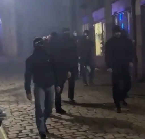 The antifa gang closes in before attacking the people at the vigil.