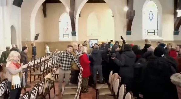 The liberal gang, dressed in black, taking over the church.