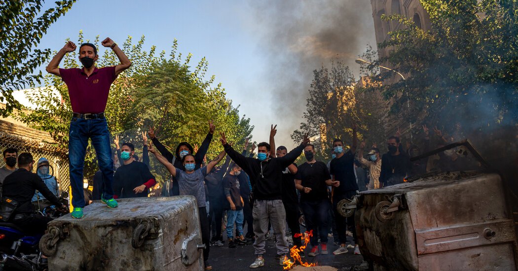 Iranian authorities crack down on protests at Tehran apartment complex.